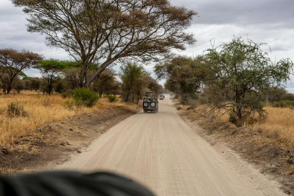 A jeep drives through the dusty roads as it approaches Samburu National Reserve - read this guide for full details on how to get to Samburu National Reserve